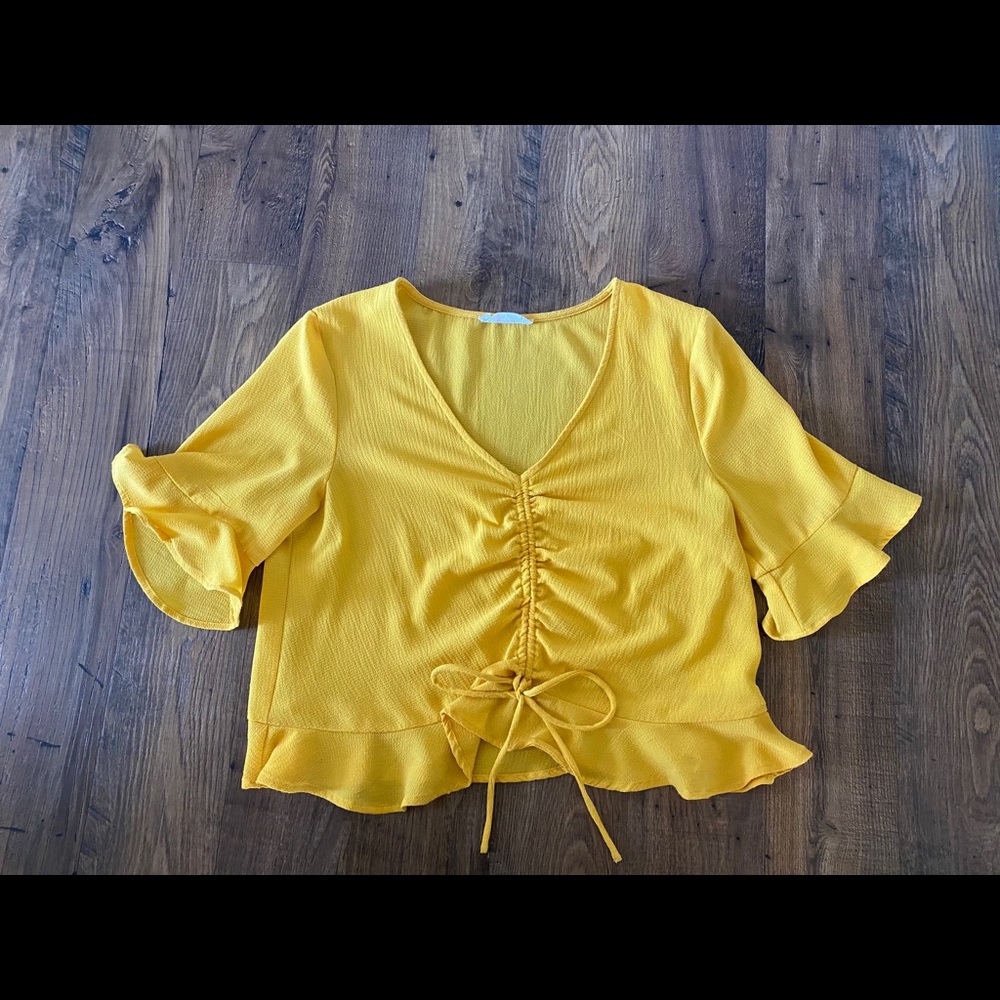 Yellow peplum cropped top